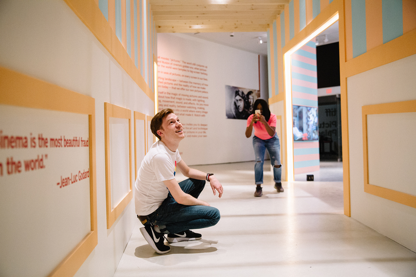 TIFF Picture Palace environment with large graphics and visitors in the space.