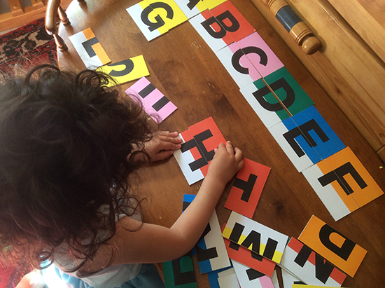 Letterform: Alpha cube packaging with belly-band and stacked cards.