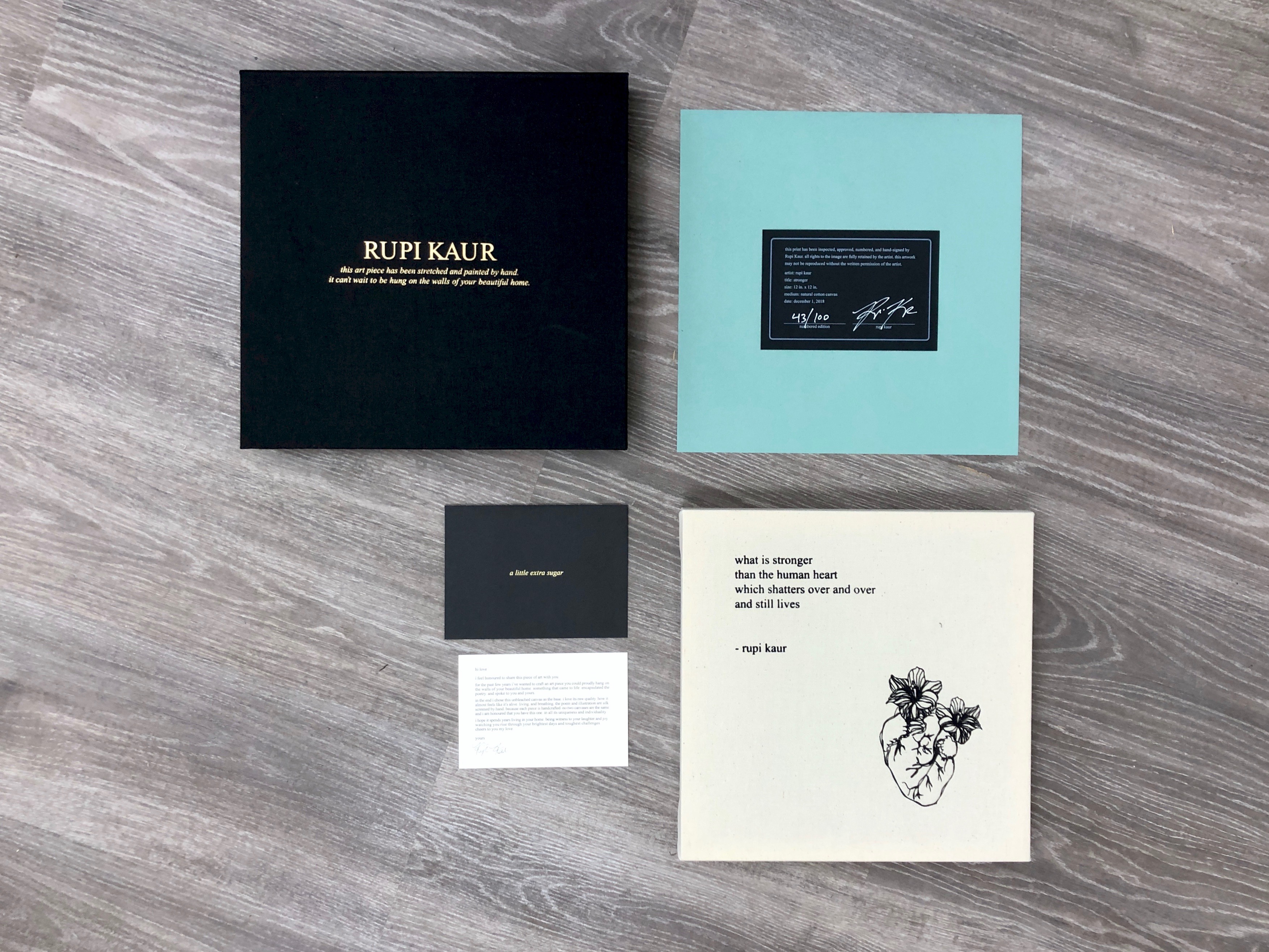 Rupi Kaur serigraph print with packaging mock-up on a work surface.